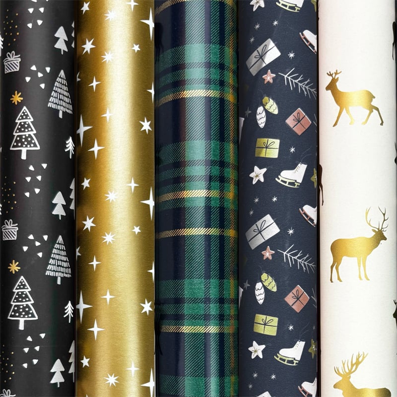Presentpapper konsumentrullar i box. X-mas fun